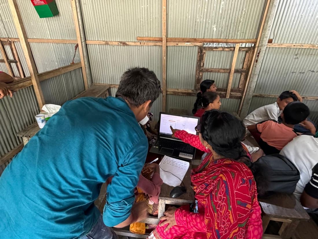 A teacher working through a lesson with students