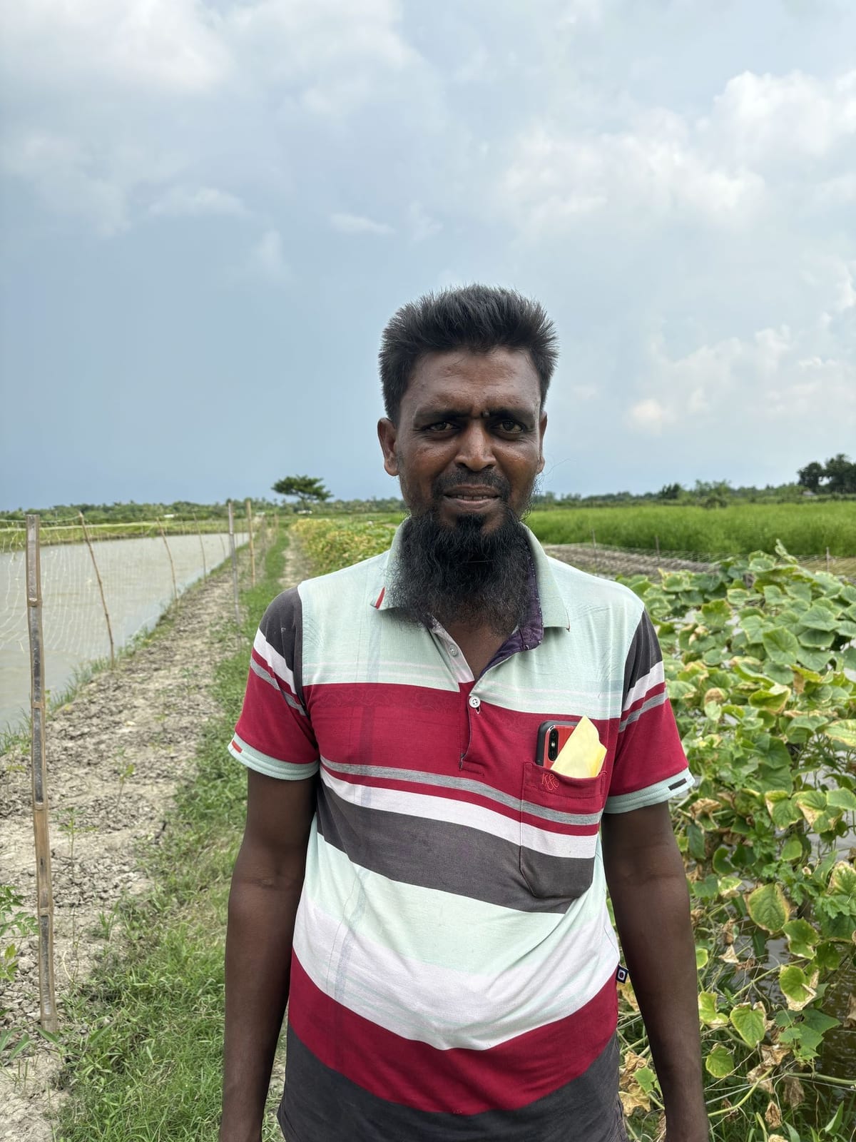 A farmer at the edge of his plot